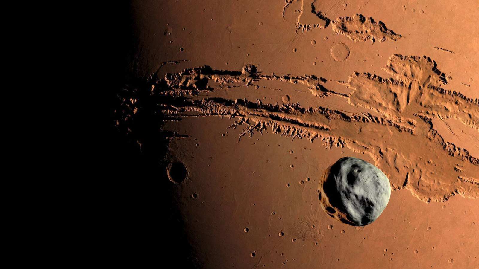 必应壁纸 2017年10月7日 火星上的峡谷系统-水手号峡谷地区上的小行星